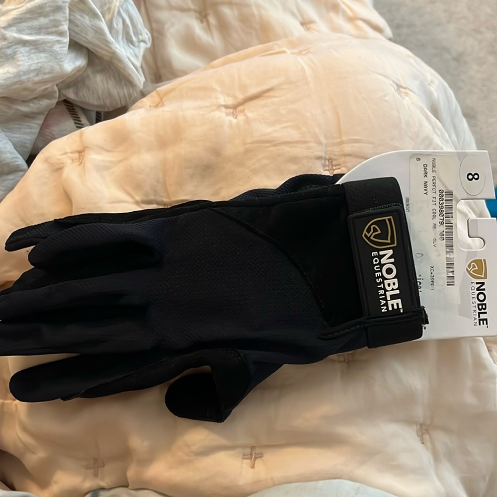 Brand new equestrian riding gloves. Dark navy size 8.